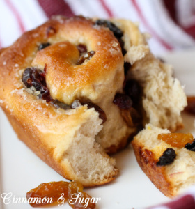 An iconic British recipe, Chelsea Buns combine raisins, cranberries, & sultanans with a rich yeast dough, flavored with cinnamon and lemon zest.