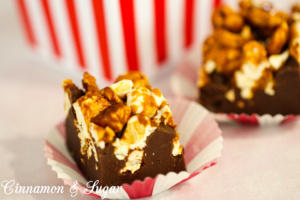 Popcorn Fudge combines amazing crunchy caramel corn on top of a thick layer of fool-proof creamy, rich fudge which boasts a hint of spiciness. Recipe shared with permission granted by Kristi Abbott, author of KERNEL OF TRUTH.