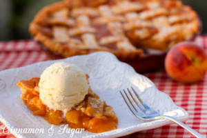 Juicy sweet peaches are laced with brown sugar, cinnamon, and nutmeg then topped with a flaky lattice crust to make the BEST peach pie ever! 