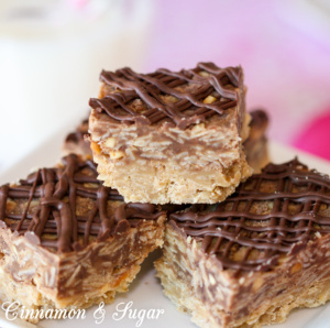 Preacher Cookies are no-bake bar cookies with layers of peanut butter & chocolate then topped with chocolate drizzle. Quick to mix up using pantry staples. 