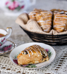 Whiskey and cinnamon simmered raisins infuse these Drunken Raisin Scones with loads of spiced flavor while the flaky, tender pastry will melt in your mouth!