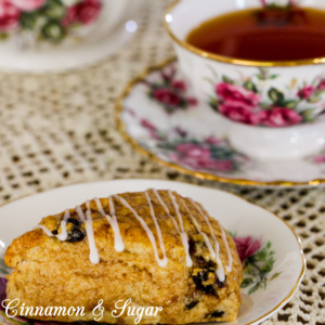 Whiskey and cinnamon simmered raisins infuse these Drunken Raisin Scones with loads of spiced flavor while the flaky, tender pastry will melt in your mouth!