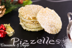 Serafina's Pizzelles (Italian Christmas Waffle Cookies) have a delicate flavor and are beautifully lacy with the addition of a dusting of powdered sugar. 