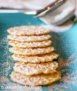 Serafina's Pizzelles (Italian Christmas Waffle Cookies) have a delicate flavor and are beautifully lacy with the addition of a dusting of powdered sugar. 