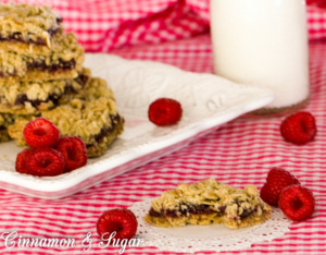 Oatmeal Raspberry Crumble Bars mix up quickly with a hearty, tasty crust and topping sandwiching sweet-tart raspberry filling providing a satisfying treat. 