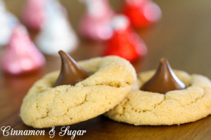 Soft and chewy peanut butter cookies combine with sweet milk chocolate kisses to make everyone's favorite Peanut Butter Blossom Cookies! 