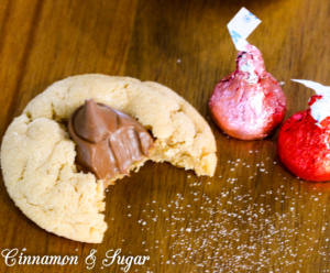 Soft and chewy peanut butter cookies combine with sweet milk chocolate kisses to make everyone's favorite Peanut Butter Blossom Cookies! 