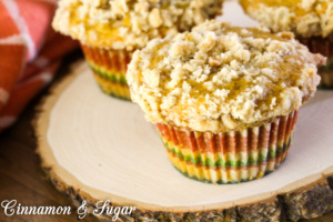 Pumpkin Cream Cheese-filled Muffins with Streusel Topping are lightly spiced muffins with a tangy, creamy center, while streusel provides crunchy contrast.