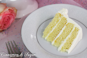 White Cake with White Chocolate Ganache Frosting is a moist tender cake filled and covered with rich yet fluffy frosting. Perfect for any special occasion!