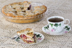 Flaky and buttery crust, fresh ruby red rhubarb with a silky sauce creates a delectable spring and summer dessert in this Rhubarb Custard Pie family recipe.