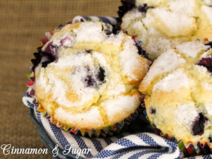 Mrs. Hudson's Tea Room Blueberry Muffins are tender vanilla cakes filled with juicy blueberries and topped with nutmeg-scented sugar for a crunchy contrast.