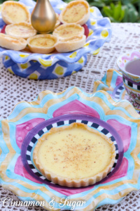 A classic, English Egg Custard Tarts are flaky pastry shells filled with a creamy, rich custard that is delicately flavored with vanilla and nutmeg.