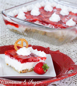 Salty, crunchy pretzel crust is topped with tangy and creamy cream cheese then crowned with sweet strawberry jello and juicy ripe fresh strawberries. 