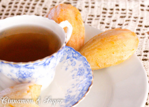 Orange Cardamom Madeleines are part cookie, part mini cakes and full of citrusy cardamom flavor. An orange glaze tops these delectable tea time treats. 