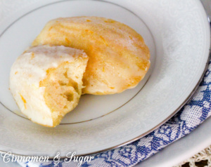 Orange Cardamom Madeleines are part cookie, part mini cakes and full of citrusy cardamom flavor. An orange glaze tops these delectable tea time treats. 