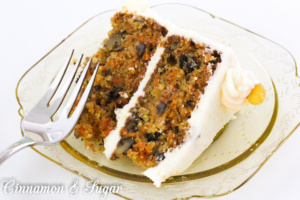 Carrot Cake with Cream Cheese Frosting and Candied Ginger is chock-full of carrots, nuts, spices, and citrus. Tangy cream cheese frosting and candied ginger adorns this cake that is worthy of any special occasion or any reason to splurge and treat yourself to a very delicious dessert!