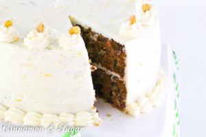 Carrot Cake with Cream Cheese Frosting and Candied Ginger is chock-full of carrots, nuts, spices, and citrus. Tangy cream cheese frosting and candied ginger adorns this cake that is worthy of any special occasion or any reason to splurge and treat yourself to a very delicious dessert!