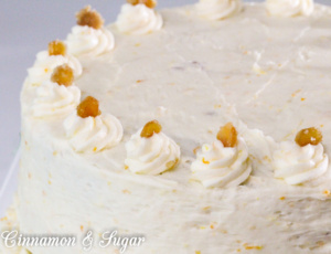 Carrot Cake with Cream Cheese Frosting and Candied Ginger is chock-full of carrots, nuts, spices, and citrus. Tangy cream cheese frosting and candied ginger adorns this cake that is worthy of any special occasion or any reason to splurge and treat yourself to a very delicious dessert!