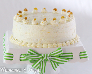 Carrot Cake with Cream Cheese Frosting and Candied Ginger is chock-full of carrots, nuts, spices, and citrus. Tangy cream cheese frosting and candied ginger adorns this cake that is worthy of any special occasion or any reason to splurge and treat yourself to a very delicious dessert!