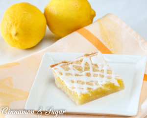 Lemon Love Notes starts with a flaky, buttery crust and then topped with a sweet tart lemony filling while a drizzle of icing adds visual appeal. A delightful, refreshing end to any meal!