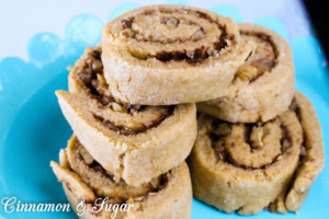 Cinnamon Roll-Overs Dog Treats are whole grain dog treats that are sweetened with a bit of honey and cinnamon then rolled up with finely chopped walnuts or pecans. Your dog will do lots of roll-overs to show you how much they love these yummy treats! 