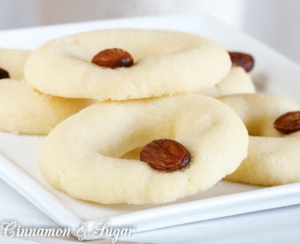 Lucy's White Almond Cookies uses only four simple ingredients plus whole almonds for garnishing to create a melt-in-your-mouth shortbread-style delectable treat! 