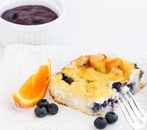 Rich & satisfying with eggs, dairy, and blueberries and topped with a warm blueberry sauce, Baked Blueberry French Toast is a delicious make-ahead dish! 