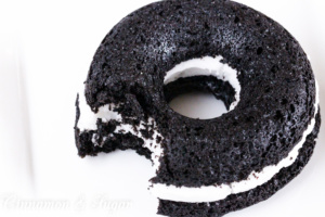 Black-and-Whites Baked Donuts are rich, super chocolately donuts with a creamy filling, reminiscent of everyone's favorite chocolate sandwich cookies. 