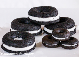 Black-and-Whites Baked Donuts are rich, super chocolately donuts with a creamy filling, reminiscent of everyone's favorite chocolate sandwich cookies. 