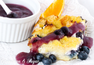 Rich & satisfying with eggs, dairy, and blueberries and topped with a warm blueberry sauce, Baked Blueberry French Toast is a delicious make-ahead dish! 