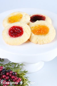 Jewel Brooch Cookies are easy to make with the jewel tones of the jam making these shortbread-style cookies a festive addition to any holiday cookie plate!