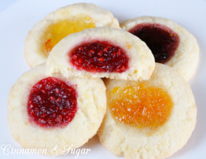 Jewel Brooch Cookies are easy to make with the jewel tones of the jam making these shortbread-style cookies a festive addition to any holiday cookie plate!