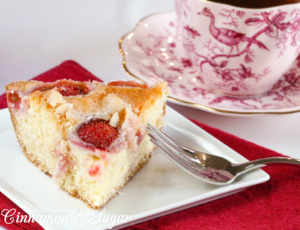 Tender, moist vanilla Strawberry Cake is topped with loads of fresh strawberries and is as delicious as it is beautiful without having to rely on frosting.