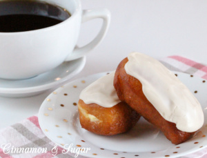 Cream-filled Maple Bars are yeasty deep-fried donuts that are filled with sweet vanilla cream then topped with maple frosting. Perfect with coffee or tea! 