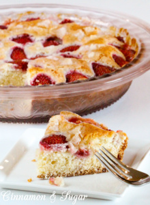 Tender, moist vanilla Strawberry Cake is topped with loads of fresh strawberries and is as delicious as it is beautiful without having to rely on frosting.