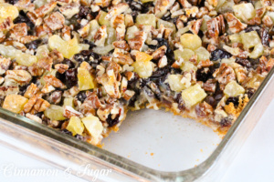 Layers of graham cracker crumbs, coconut, dates, cherries, pineapple, pecans, and sweetened condensed milk mix up in a jiffy to create sweet, chewy Church Basement Funeral Bars! 