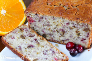 Tart cranberries, zingy orange zest and orange juice and crunchy walnuts combine to create delectable Cranberrry Orange Bread. Recipe created by Maddie Day, author of cozy mystery MURDER ON CAPE COD.