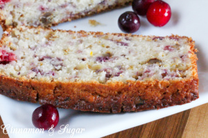 Tart cranberries, zingy orange zest and orange juice and crunchy walnuts combine to create delectable Cranberrry Orange Bread. Recipe created by Maddie Day, author of cozy mystery MURDER ON CAPE COD.