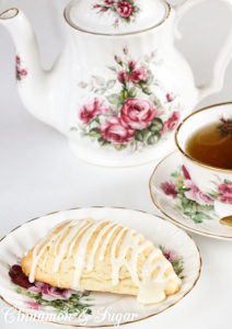 Eggnog Scones are flaky, buttery, and melt-in-your-mouth yummy! Perfect for the holidays or even a special treat no matter what time of year it is! Recipe shared with permission granted by Laura Childs, author of BROKEN BONE CHINA.