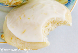 Lemon Ricotta Cookies are super moist lemony, cake-like cookies, thanks to the ricotta cheese while the icing brings an extra bite of tart & sweet flavors. Recipe shared from Debra Sennefelder, author of THE HIDDEN CORPSE.