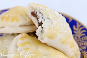 Lucy's Date-Stuffed Cookies have a sweet, cinnamon-y filling that is encased in flaky cookie dough -- like a mini turnover! Recipe shared with permission granted by Tina Kashian, author of ONE FETA IN THE GRAVE.