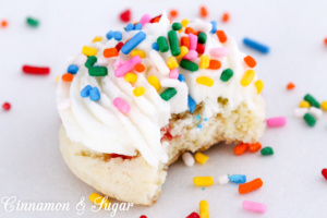 Sprinkled with Fun Cookies start with a base of cake mix, resulting in cake-like treats that take mere minutes to scoop onto a baking sheet and begin baking. Recipe shared with permission granted by Catherine Bruns, author of SPRINKLED IN MALICE.