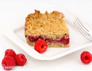 Berry Crumb Bars start with an easy to make dough that serves as both the crust and crumb topping, while a generous amount of juicy berries provide a jammy filling. Recipe shared from cozy mystery SOUTHERN SASS AND KILLER CRAVINGS by Kate Young.