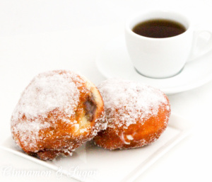 Popular in Hawaii, malasadas are rich with eggs, butter and milk. Deep-fried, then coated with sugar, these pillowy donuts are filled with coconut or chocolate custard. Recipe shared with permission granted by Josi Avari, author of NEST EGG.