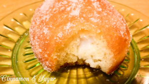Popular in Hawaii, malasadas are rich with eggs, butter and milk. Deep-fried, then coated with sugar, these pillowy donuts are filled with coconut or chocolate custard. Recipe shared with permission granted by Josi Avari, author of NEST EGG.