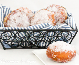 Popular in Hawaii, malasadas are rich with eggs, butter and milk. Deep-fried, then coated with sugar, these pillowy donuts are filled with coconut or chocolate custard. Recipe shared with permission granted by Josi Avari, author of NEST EGG.