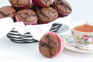 Chocolate Chocolate Chip Muffins combines dark cocoa, whole wheat flour and a generous amount of mini chocolate chips for a delectable breakfast treat! Recipe shared with permission granted by Maddie Day, author of STRANGLED EGGS AND HAM.