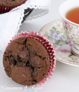 Chocolate Chocolate Chip Muffins combines dark cocoa, whole wheat flour and a generous amount of mini chocolate chips for a delectable breakfast treat! Recipe shared with permission granted by Maddie Day, author of STRANGLED EGGS AND HAM.