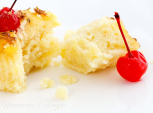 A rich, buttery pineapple cake topped with a caramelized pineapple ring and maraschino cherry make Pineapple Upside-Down Cupcakes perfect for hot summer months! Recipe shared with permission granted by Jenn McKinlay, author of DYING FOR DEVIL'S FOOD.