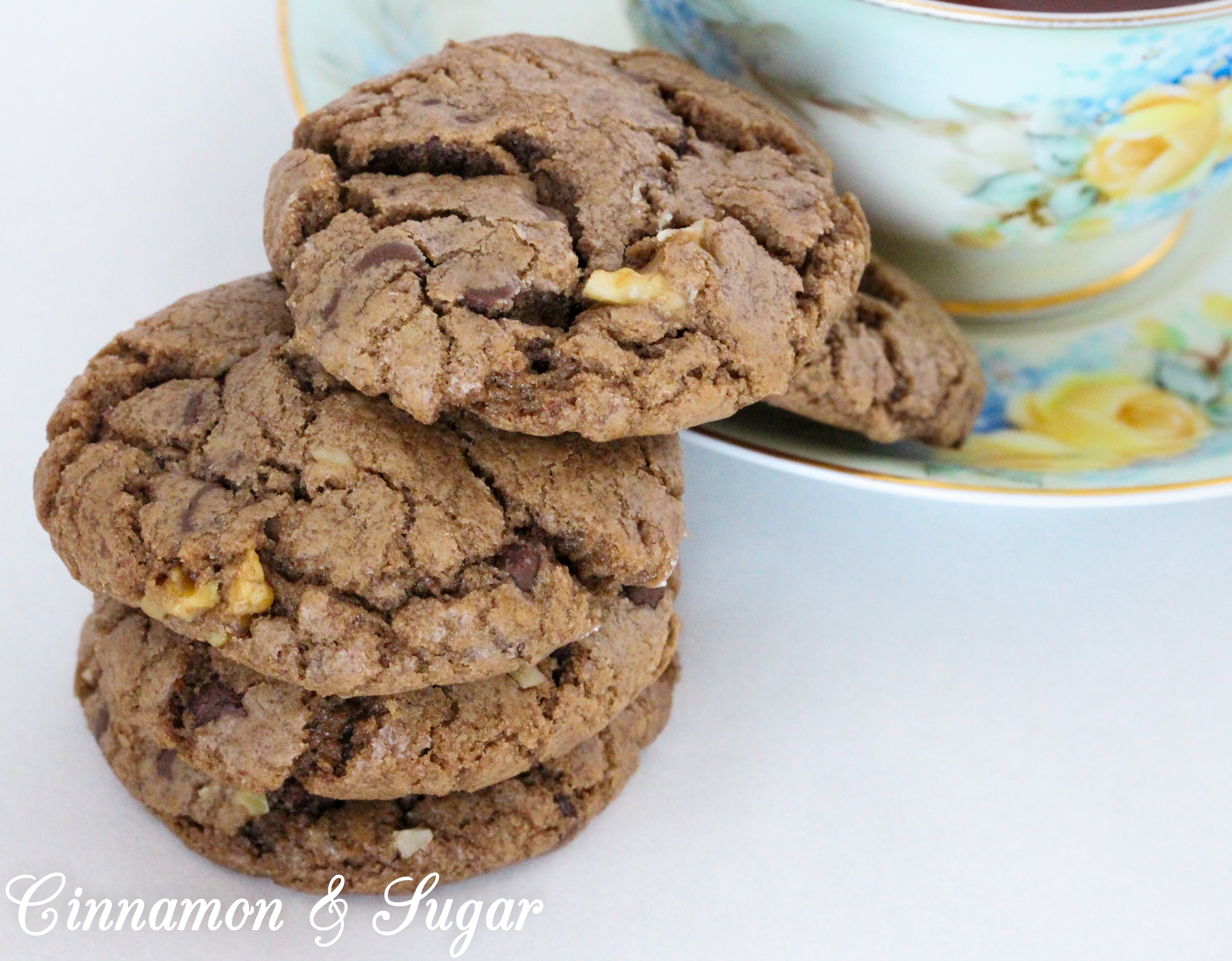 Chocolate Walnut Cookies are the perfect combination of chewy and crunchy, thanks to the melted chocolate, chocolate chips, and walnuts. Recipe shared with permission granted by Debra Sennefelder, author of Three Widows and a Corpse.